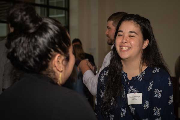 students talking at a career fair