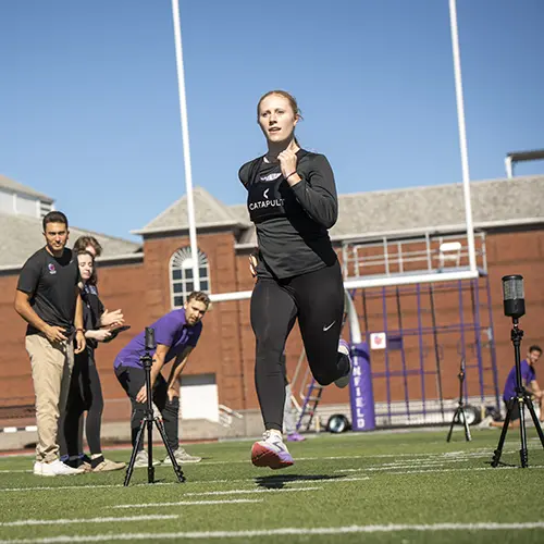 Students using technology to measure the abilities of a student athlete.