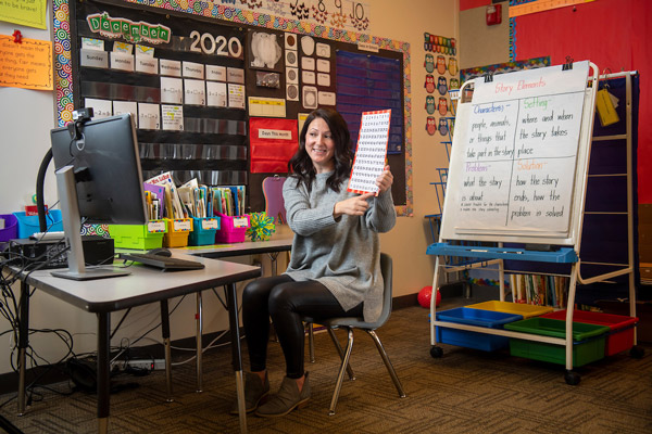 Linfield alumni teaching over Zoom in a classroom setting.