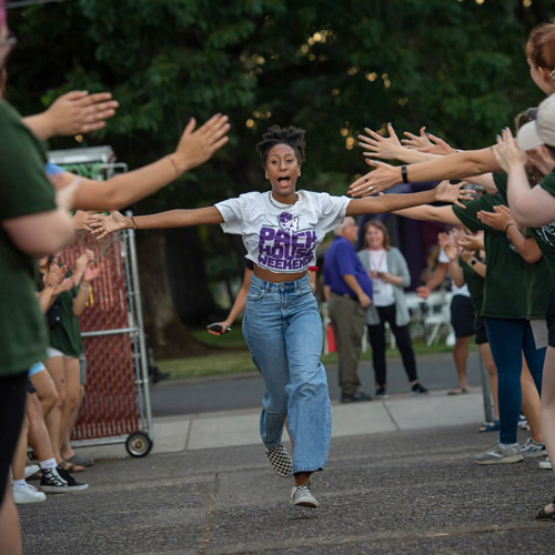 Excited female student at Cat Camp, fall 2022.