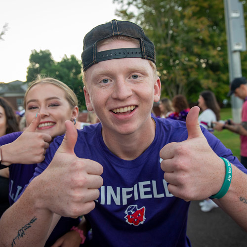 two students giving thumbs up at Cat Camp